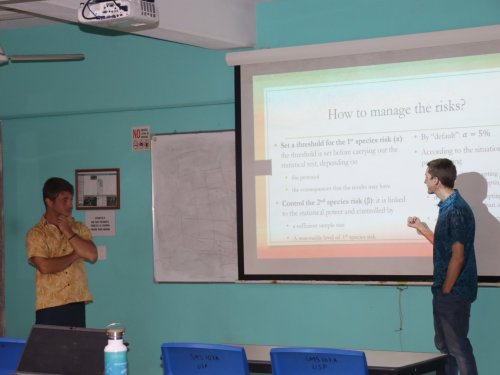 G. Wattelew and J. Brouillon presenting their R slide powerpoint on the screen